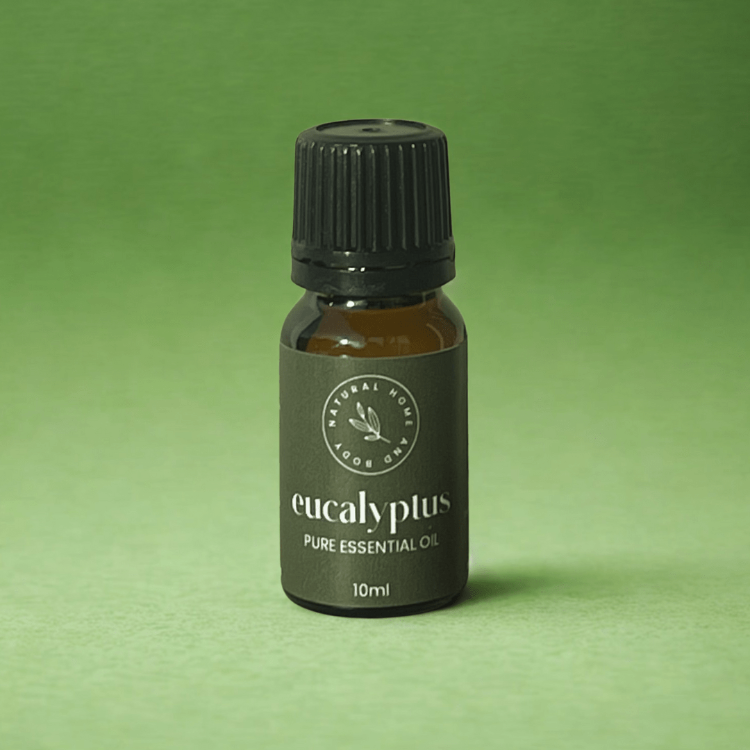 Bottle of eucalyptus pure essential oil on a green background
