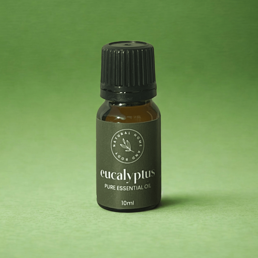 Bottle of eucalyptus pure essential oil on a green background
