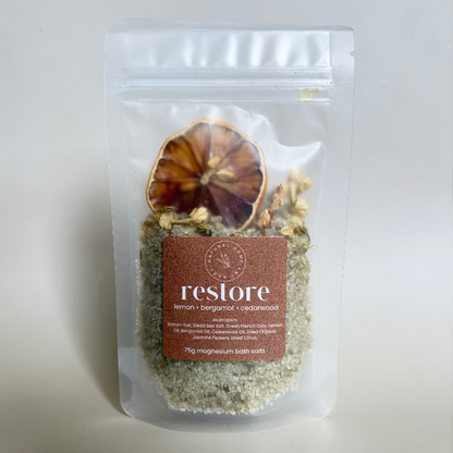 Packaged 'restore' magnesium bath salts with a label on a white background