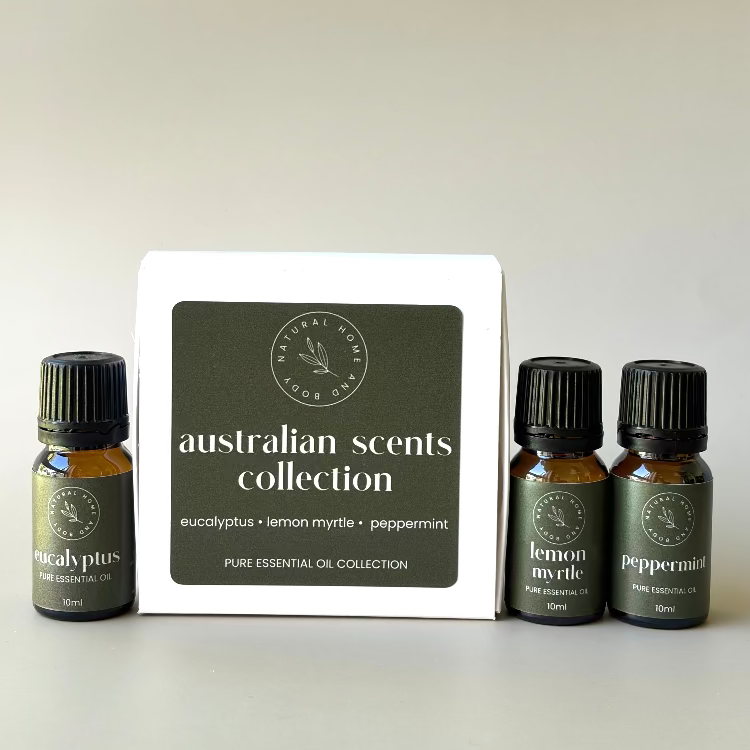 'Australian Scents Collection' trio essential oil box, with essential oil bottles labelled 'eucalyptus', 'lemon myrtle' and 'peppermint' next to the box. All with dark green product labels.