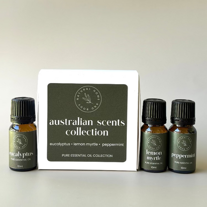 'Australian Scents Collection' trio essential oil box, with essential oil bottles labelled 'eucalyptus', 'lemon myrtle' and 'peppermint' next to the box. All with dark green product labels.