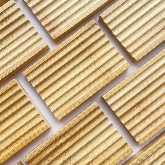 Rows of bamboo soap dishes on a diagonal pattern.