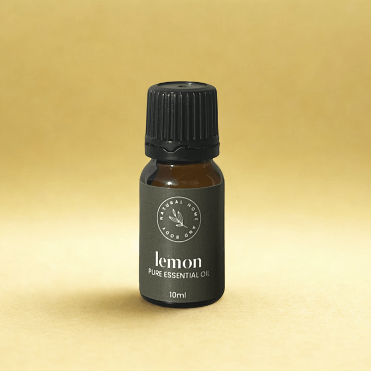 Bottle of lemon pure essential oil on a yellow background