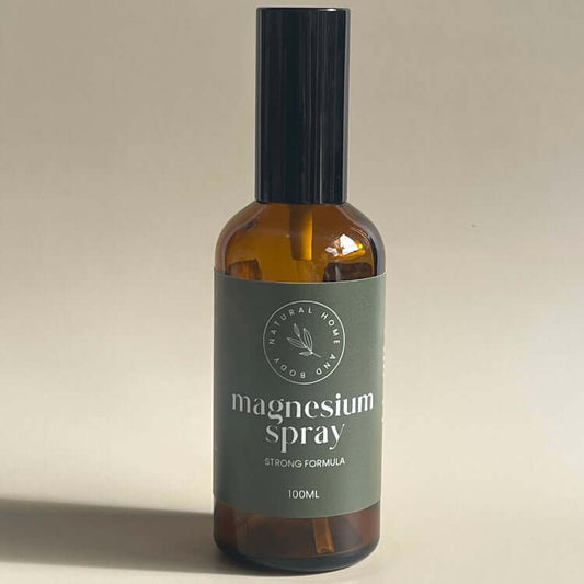 Strong formula magnesium oil spray displayed on a neutral coloured backdrop